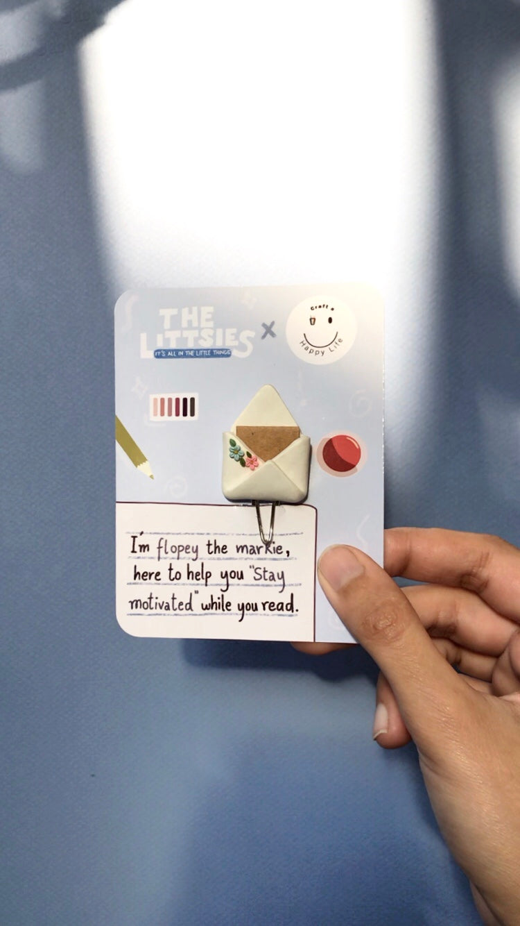 Flopey polymer clay bookmark on branded display card