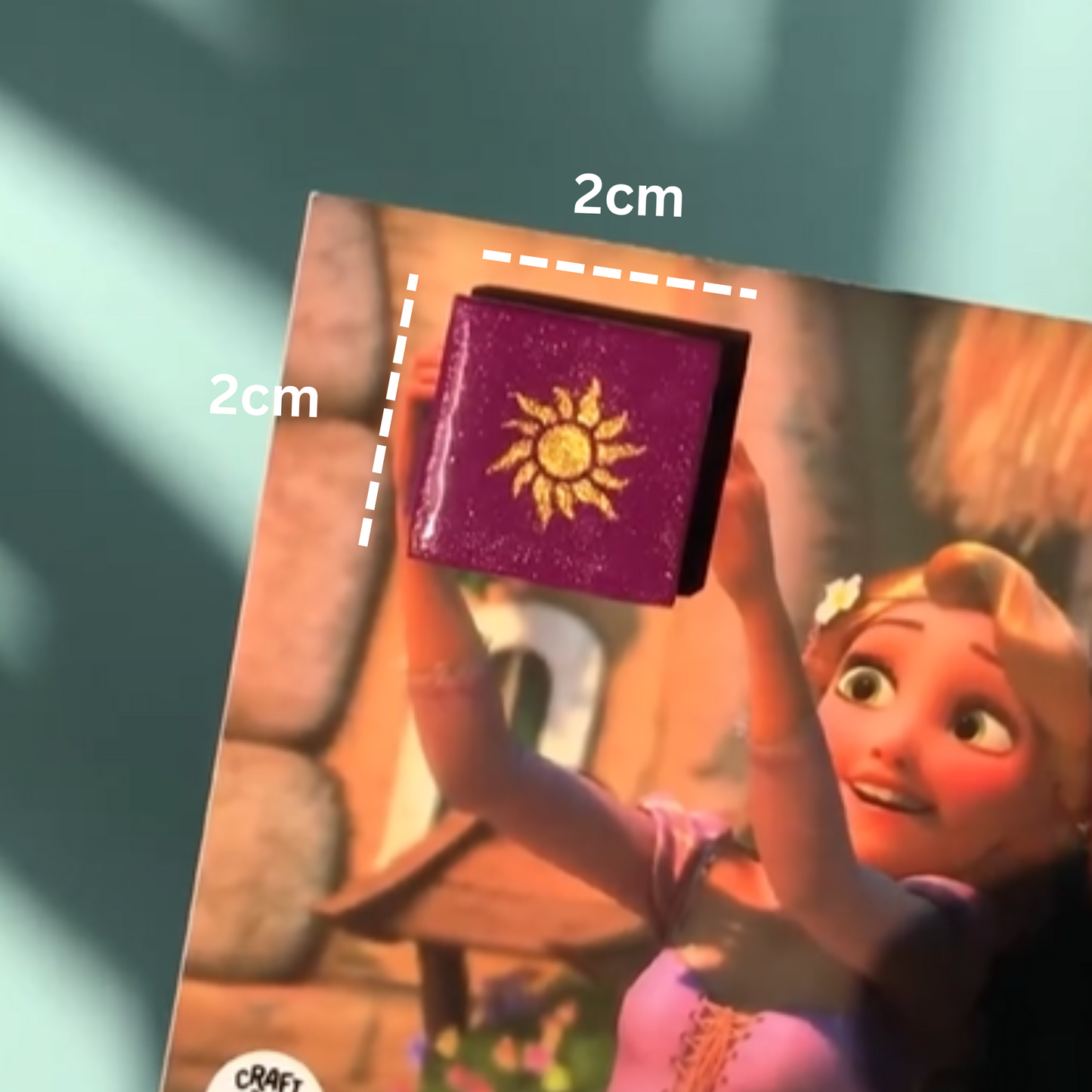 Tangled inspired purple fridge magnet showing 2 cm by 2 cm size